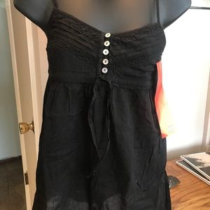 Black spaghetti strap Pimke tank top with white buttons